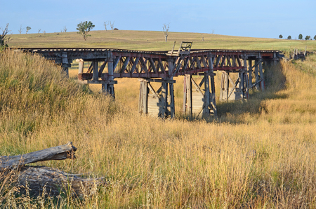Old abandoned wooden railway bridge near Boorowa, central west NSW, Australiaの写真素材