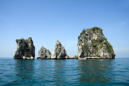 Speedboat and limestone outcrops, Krabi, Thailandの写真素材