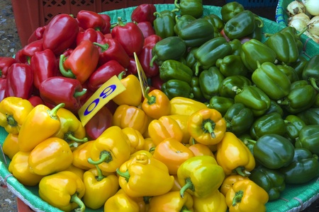 Red, yellow and green peppersの写真素材