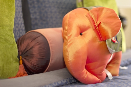 Elephant cushion on bedの写真素材