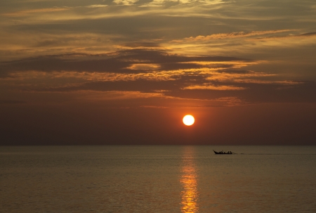 Sunset with long tailed boat, Nai Yang beach, Phuket, Thailandの写真素材