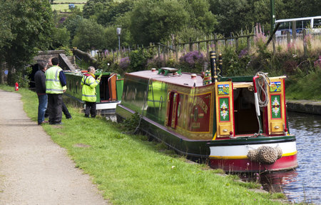 DIGGLE, ENGLAND - Aug 19TH  Waterway officials check boats before escorting them through Standedge tunnel on August 19th 2011  The tunnel is the longest and highest canal tunnel in the U K のeditorial素材