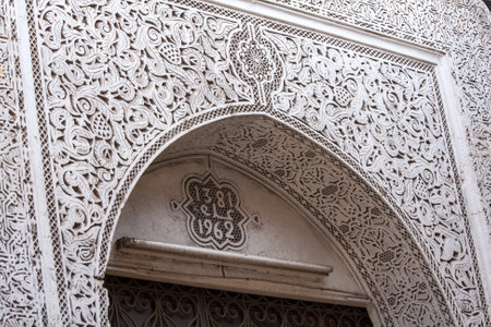 Intricate and ornate plasterwork around door arch, Marrakech, Moroccoのeditorial素材
