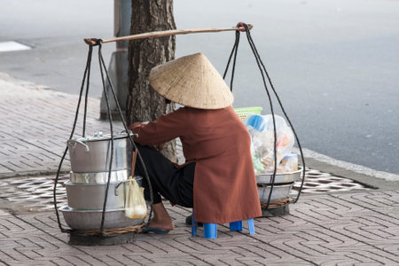 A street vendor waits for customers in Ho Chi Minh City, Vietnamのeditorial素材