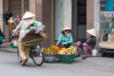 HO CHI MINH CITY, VIETNAM-NOV 3RD: Street vendors in Ho Chi Minh City on November 3rd 2013. Street...