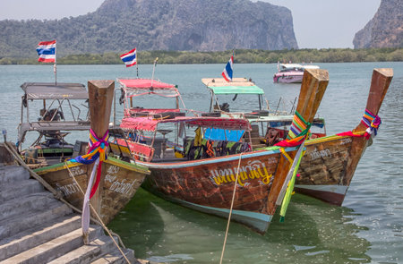 Long tailed boats waiting at Pak Meng pier, Trang Province, Thailand - HDRのeditorial素材