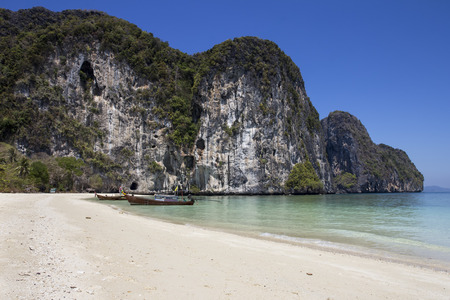 Boats moored on beach in Koh Rok Yai, Trang Province, Thailandの写真素材