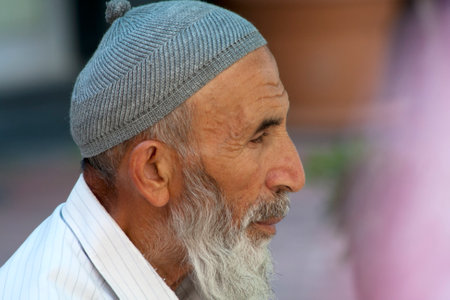 Alanya, Turkey-September 20th 2011  Man wearing a traditional Turkish skull cap  The cap is made of...