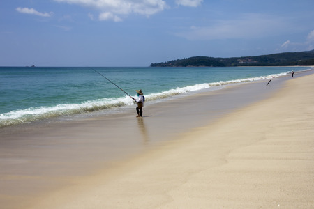 Fishing on Bang Tao beach, Phuket, Thailandの写真素材