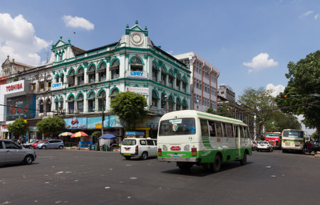 Yangon, Myanmar-May 8th 2014: A bus passes through an intersection in the city. Buses are the main form of transport in Yangon.のeditorial素材