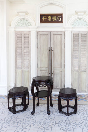 Traditional chinese table and stool furniture outside a typical Phuket houseのeditorial素材