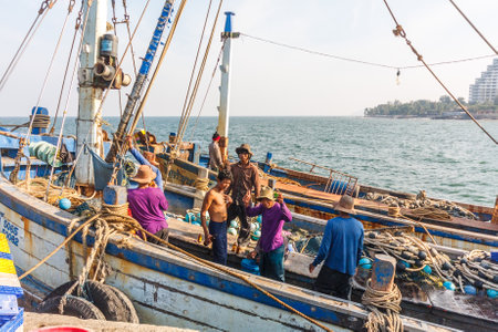 Hua Hin, Thailand - November 17th 2011: Burmese fishermen onboard a fishing boat. Many Thai fishing boats are manned by Burmese.のeditorial素材