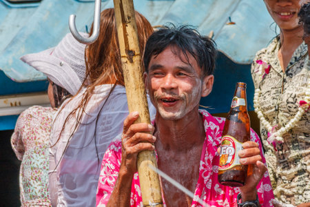 Phuket, Thailand - April 13th 2011: Thais celebrating Songkran New Year water festival. The event attracts many foreign tourists.のeditorial素材