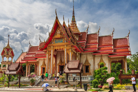 Phuket, Thailand - June 5th 2011: People entering the buddhist wat in Chalong. The temple is the most famous on the island.のeditorial素材