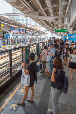 Bangkok, Thailand - March 10th 2017: Passengers waiting for  the skytrain at Asoke station. This is one of the busiest stations as it connects with the MRT.のeditorial素材