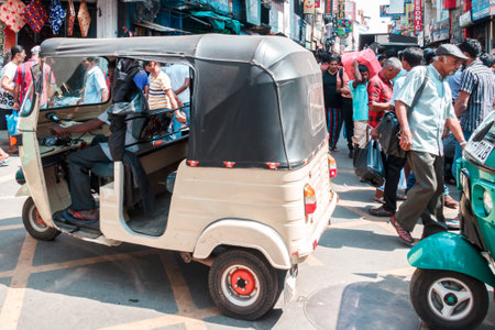 Colombo. Sri Lanka - December 21st 2016: A tuk tuk makes its way down a street in the Pettah district. This is the main commercial area.のeditorial素材