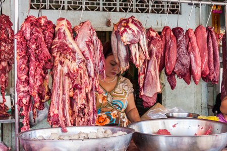 Ho Chi Minh City, Vietnam - February 24th 2010: Meat stall on Cholon market. The market is one of...