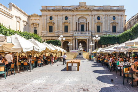 Valletta, Malta - September 13th 2015: Cafes full of tourists on Republic Street. The city is a popular cruise destination.のeditorial素材