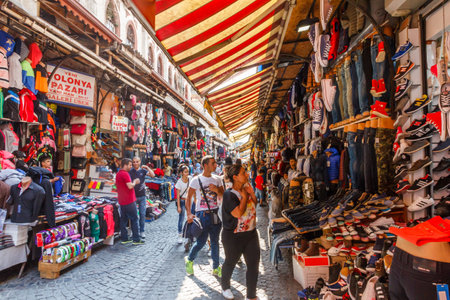 Istanbul, Turkey - September 21st 2015:  People shopping in a busy shopping street. The shops sell clothes, souvenirs to tourists and local produce.のeditorial素材