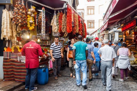 Istanbul, Turkey - September 21st 2015: People thronging a busy shopping street. Shops sell souvenirs, clothes and local produce.のeditorial素材