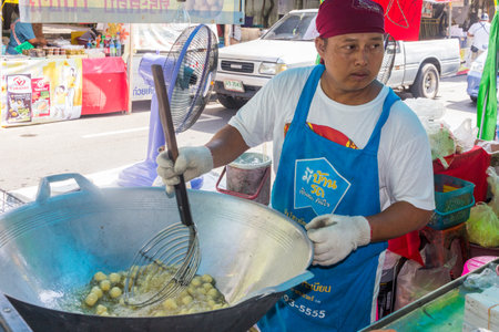 Phuket, Thailand - October 13th 2015: Man cooking vegetarian food at the annual Phuket vegetarian festival. The festival is also known as the Nine Emperor Gods Festivalのeditorial素材