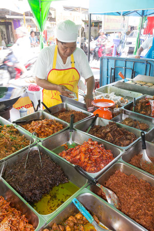Phuket, Thailand - October 13th 2015: Serving vegetarian food at the annual Phuket vegetarian festival. The festival is also known as the Nine Emperor Gods Festivalのeditorial素材