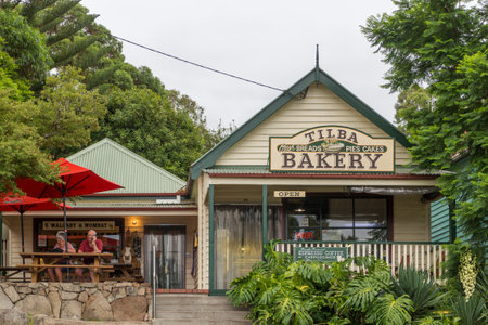 Tilba, Australia - 13th February 2018: People sat outside a Bakery shop and cafe. Coffee culture is popular.のeditorial素材