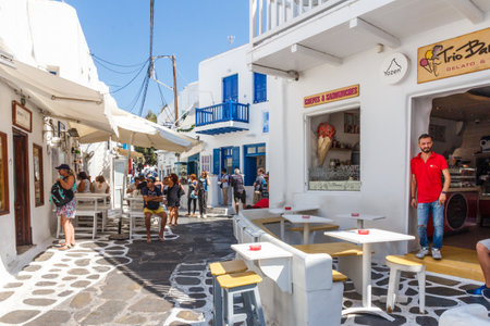 Mykonos, Greece - September 15th 2015: Tourists throng the streets of Chora. This is the main town on the island.のeditorial素材