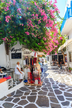 Mykonos, Greece - September 15th 2015: Tourists sitting in cafes in Chora This is the main town on the island.のeditorial素材