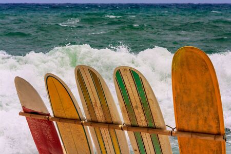 Surfboards against a rough sea backgroundの写真素材