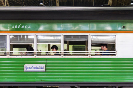 Bangkok, Thailand - August 11th 2017: Passengers sat in green carriage, Hua Lamphong station. Trains depart to the north and south of the country.のeditorial素材