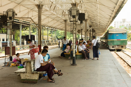 Yangon, Myanmar - May 5th 2014: People waiting on the platform at the main railway station. The...