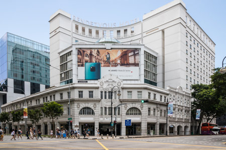 Singapore - July 8th 2019: People crossing Prinsep street by the Rendezvous Hotel. The hotel is located next to Bras Basah MRTのeditorial素材