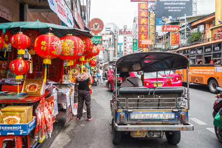 Bangkok, Thailand - October 26th 2013: Tuk tuk on Yaowarat road. Chinatown is the oldest part of the...
