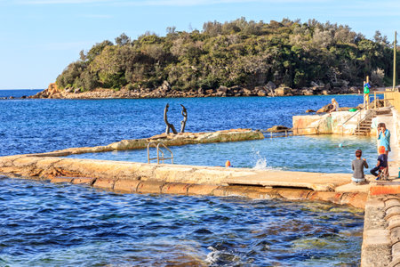 Manly, Australia - June 9th 2015: People swimmimg in sea water pool near Shelly beach. Sea water pools are favourite swiiming areas.のeditorial素材