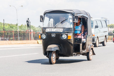 Colombo, Sri Lanka - March 16th 2011: A tuk tuk carrying passengers. This is a cheap way of getting around the city.のeditorial素材