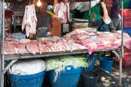 Bangkok, Thailand - January 9th 2020: Meat stall on Khlong Toei wet market. This is the largest wet market in the city.のeditorial素材