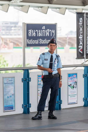 Bangkok, Thailand - July 8th 2010: A guard stands on the platform at the National Stadium station. The station is part of the Skytrain network.のeditorial素材