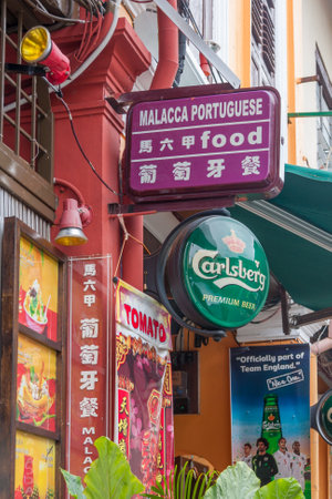 Malacca, Malaysia - 8th June 2010: Signs outside a restaurant, bar. The city has many bars and restaurants catering to tourists.のeditorial素材