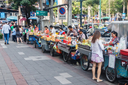 Bangkok, Thailand - November 17th 2015:  Street vendors crowd Sukhumvit Road. Many areas are now prohibited to street vendors.のeditorial素材
