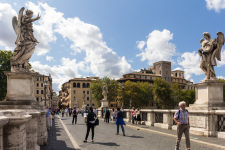 Rome, Italy - 19th September 2017:  People walking across the pedestrian Ponte Sant Angelo. The bridge is lined with statues.のeditorial素材