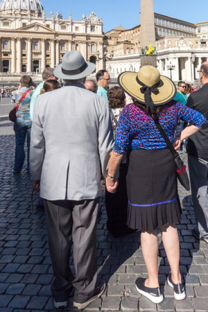 Vatican City, Rome, Italy - September 18th 2017: Senior tourists at the Apostolic Palace, St Peters Square. Many tourists visit the city each year.のeditorial素材