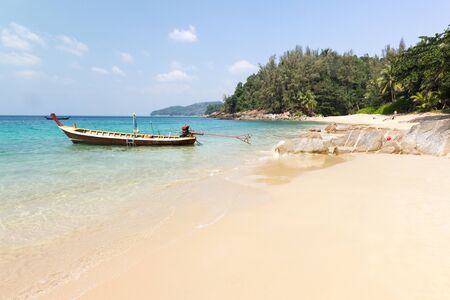 Longtail boat anchored at Banana beach, Phuket, Thailandの写真素材