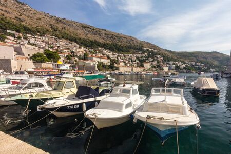 Dubrovnik, Croatia - 24th September 2017: Dubrovnik old town harbour. The city is considering limiting the number of cruise ships due to overcrowding.の写真素材