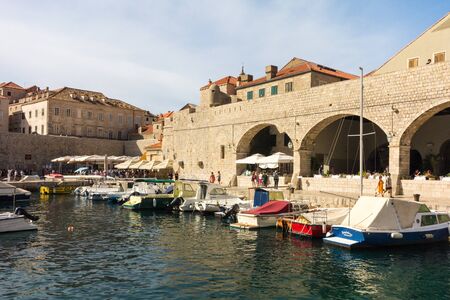 Dubrovnik, Croatia - 24th September 2017: Dubrovnik old town harbour. The city is considering limiting the number of cruise ships due to overcrowding.の写真素材