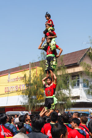 Khon Kaen - November 21st 2009: Human pyramid at the Silk Festival. It is an annual event.のeditorial素材