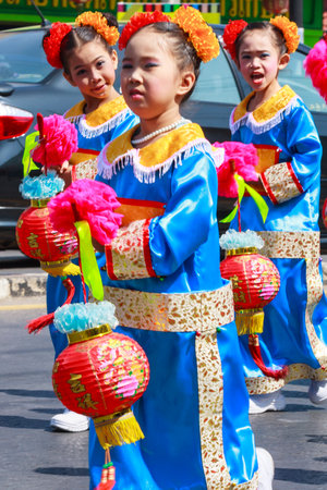 Khon Kaen, Thailand - November 21st 2009. Young dancers in Silk Festival parade. The festival is an annual event.のeditorial素材