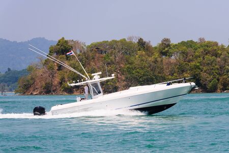 Fast speedboat cruising in Phang Nga Bay off Phuket, Thailandの写真素材