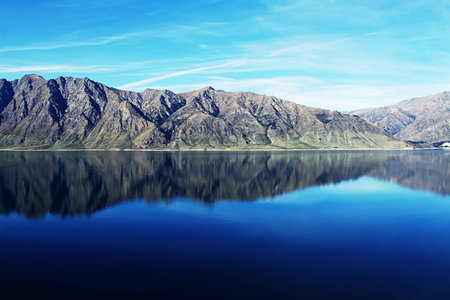 mountains reflecting in Lake Wanakaの写真素材