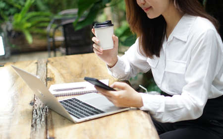 Close up of a woman hands freelance working Online working from home, business and technology conceptの写真素材